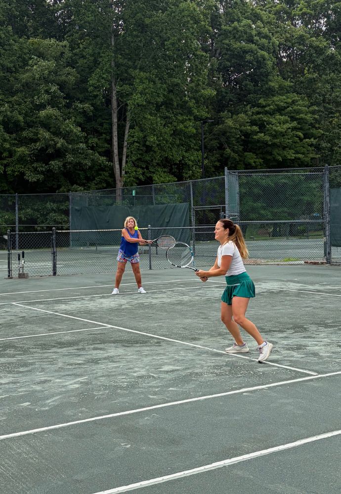 Two Female Members play doubles at Asheboro